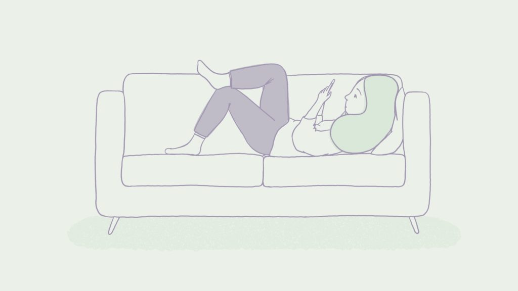 hire a freelance illustrator - illustration of girl looking at her phone on the sofa